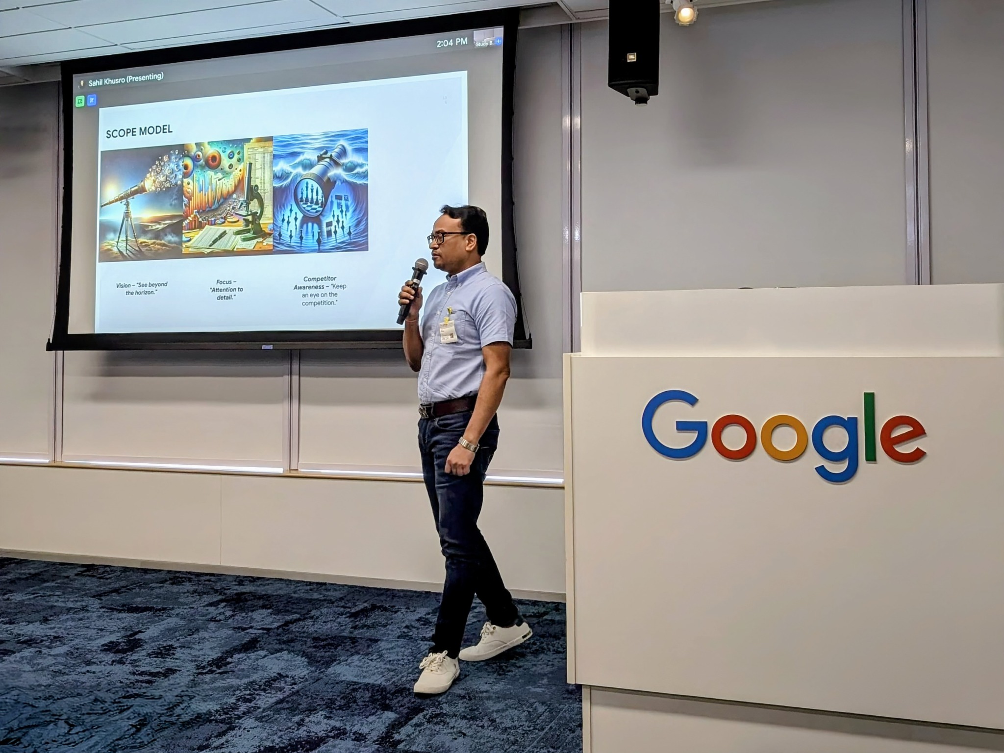 Anil Pandit explaining his SCOPE model beside the Google wordmark at an earlier speaking session